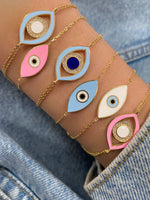yellow gold double chained and light blue and navy evil eye bracelet