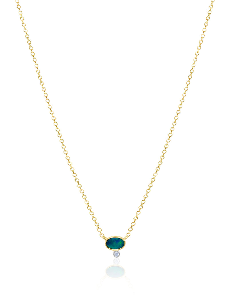 dainty yellow gold necklace with centered opal stone and diamond bezel