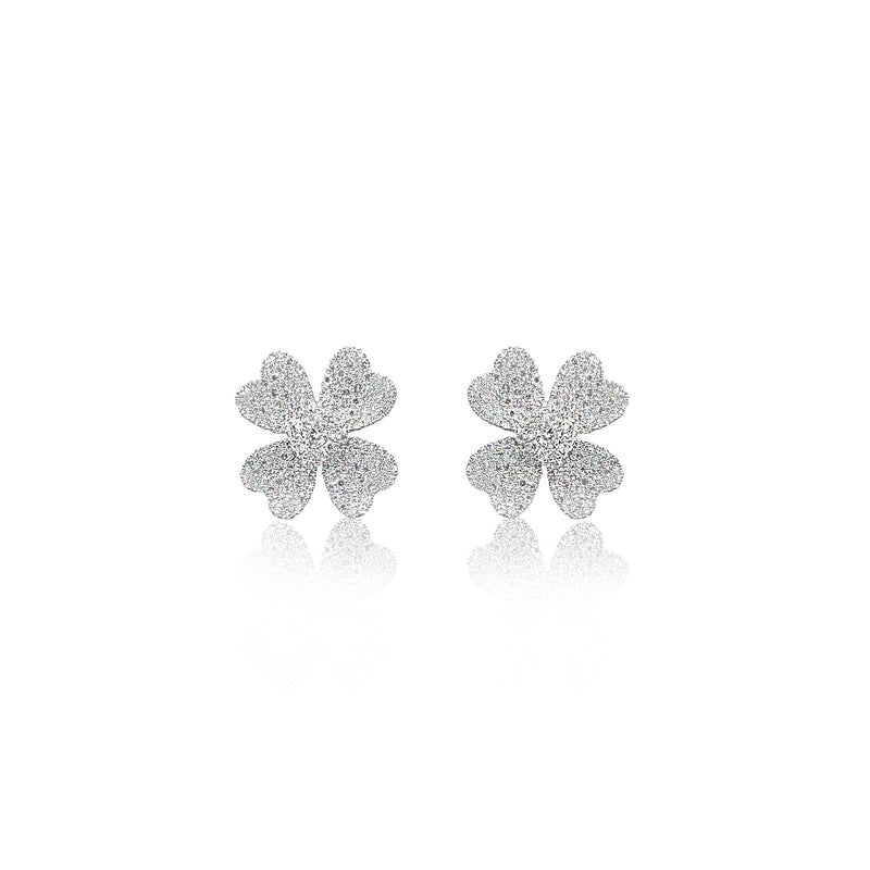 white gold and diamond encrusted flower studs
