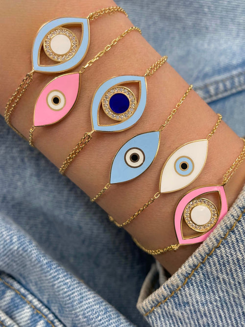 yellow gold double chained and pink evil eye bracelet