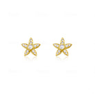yellow gold and diamond studs with centered moonstone