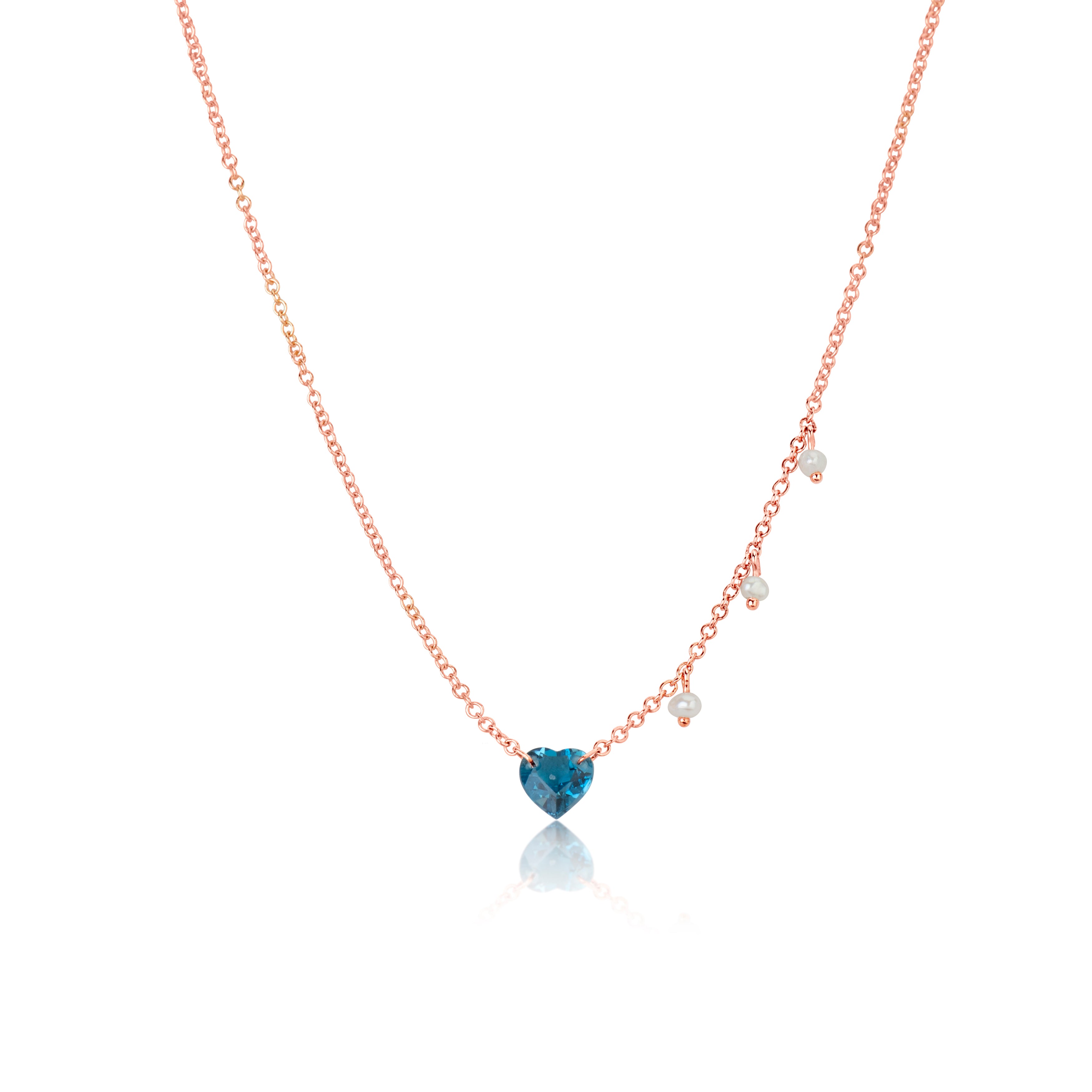 rose gold necklace with blue topaz heart and side pearl charms