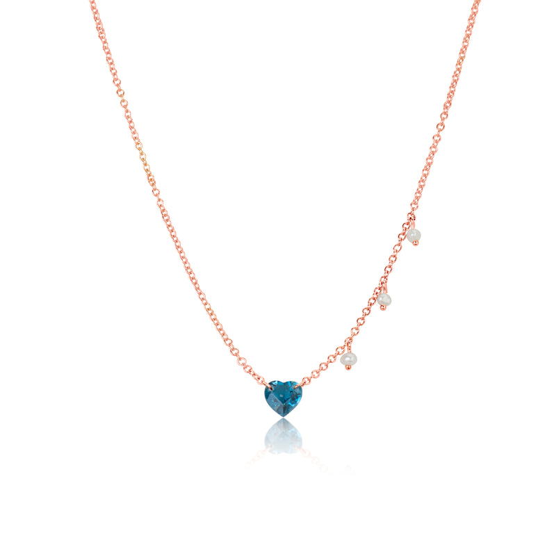 rose gold necklace with blue topaz heart and side pearl charms