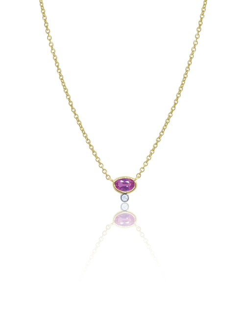 yellow gold necklace with centered pink sapphire and diamond bezel
