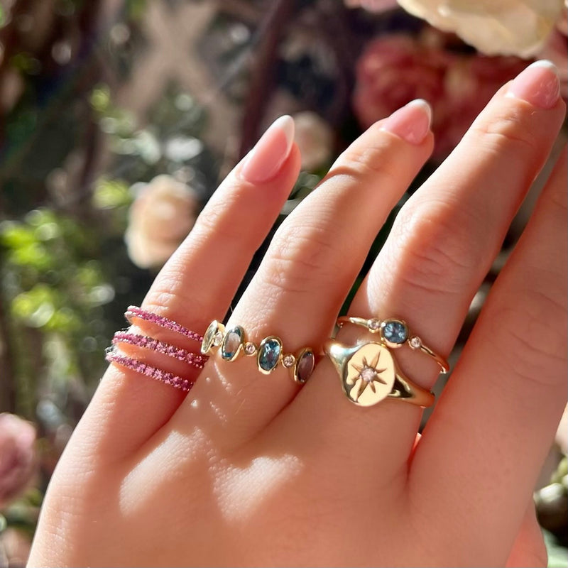 rose gold and pink sapphire swirl ring