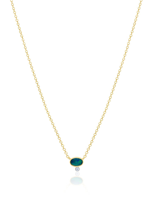 dainty yellow gold necklace with centered opal stone and diamond bezel